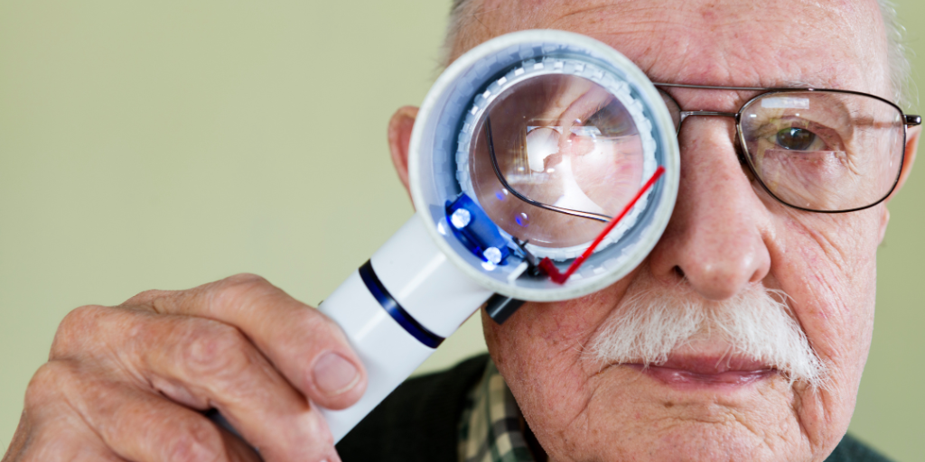 a person looking through a magnifying glass