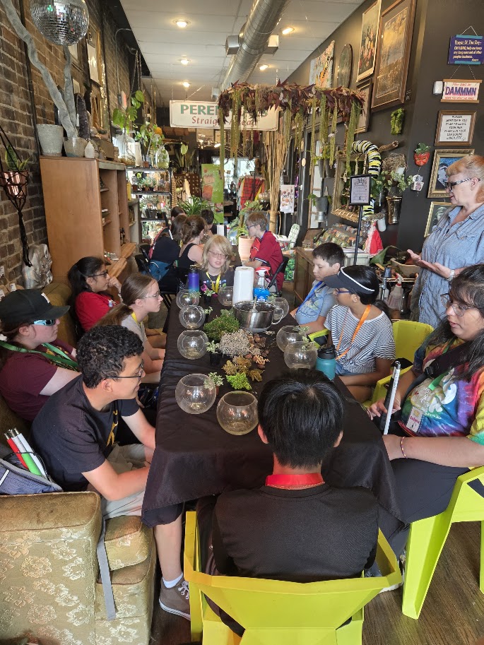 A Trip to Cosley Zoo with Grandma Martyl's Low Vision Day Camp 21 a group of young people participating in a potted plant activity.