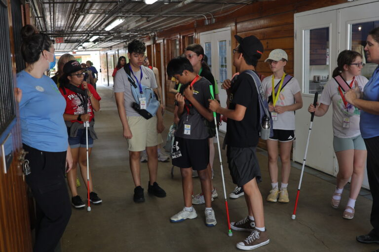 A Trip to Cosley Zoo with Grandma Martyl's Low Vision Day Camp 13 a group of teenagers in a barn.