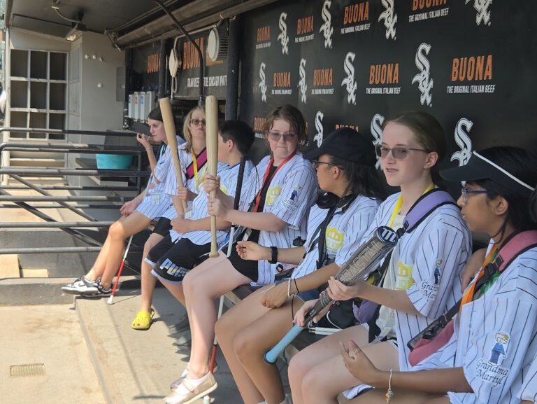 A Trip to Cosley Zoo with Grandma Martyl's Low Vision Day Camp 37 a group of young people in jerseys sitting in a White Sox dugout.