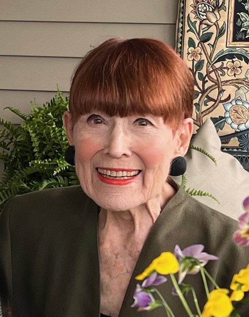 woman with red hair smiling